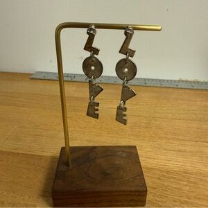 Gold tone love spell out dangle earrings